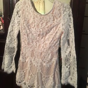 New with tags, white lace romper with nude lining